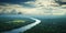 areal view of the vast amazon river and amazonian lush rain forest jungle. green forest and blue sky.