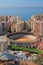 Arena for bullfight and city on sea coast. Malaga, Spain