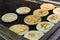 Arepas, Colombian corn patties filled with cheese, at a street food market.