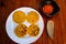 Arepas with Colombian hogao sauce cooked tomato and onion. Arepas are made from yellow corn flour and are traditionally eaten in