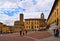 AREZZO, ITALY. Cityscape with Piazza Grande square in Arezzo with facade of old historical buildings and crowd of peopl