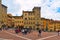AREZZO, ITALY. Cityscape with Piazza Grande square in Arezzo with facade of old historical buildings and crowd of peopl