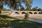 Arezzo, Tuscany, Italy: the medieval Buriano bridge over the Arno river in the park Ponte a Buriano e Penna nature reserve. It