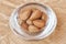 Argan nuts in a glass cup.