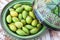 Argan nuts in a green plate.