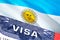 Argentina Visa Document, with Argentina flag in background. Argentina flag with Close up text VISA on USA visa stamp in passport,