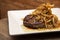 Argentine Chorizo steak, with risotto and caramelized fried onion
