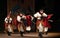 Argentine dancers performing traditional dance with red flags