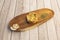 Argentine empanada stuffed with mushrooms and oregano on wooden plate