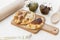 Argentine empanadas on wooden board with spices and dehydrated tomato