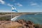 Argentine flag on overlook by the beach in Punta Tombo