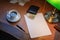 Argentine peso on a stylish desk with coffee and a lamp