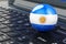 Argentinean flag on laptop keyboard. Online business, education, shopping in Argentina concept. 3D rendering