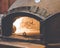 argentinian empanada inside a clay oven in a restaurant