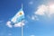 Argentinian flag waving on a blue sky with copy space