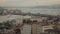 Arial panoramic cityscape of Istanbul to Bosphorus with ship traffic, Galata bridge and building at sunny sunset. Slow