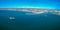 Arial shot of the harbor of Lamberts bay on the west coast of South Africa. There are two diamond diving boats at anchor in the