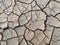 Arid and barren land caused with hot weather and drought, erosion and crack ground, abstract mosaic pattern