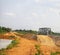 The arid ground has an iron bridge, a railway crossing in Thailand in the summer.