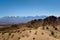 Arid hills in natural reserve El Leoncito, in the province of San Juan, Argentina. The Andes mountains can be seen in the back.