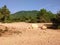 Arid hinterland. dry. barren land. little vegetation. dirt road