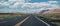 Arid landscape of Arizona. The crumbling sandstone mountains and the highway