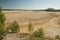 An arid terrain, cut down forest after the mining of minerals in a quarry.