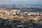 ariel panoramic view of city with huge factory with smoking chimneys in the background