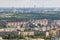 Ariel panoramic view of city and skyscrapers with a huge factory with smoking chimneys in the background