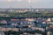 Ariel panoramic view of city and skyscrapers with a huge factory with smoking chimneys in the background