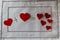 Arithmetic of love. Example with hearts on a white napkin with embroidery