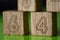 Arithmetic, mathematic, learning concept, numbers background with wooden cubes. Shallow Depth of Field