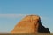 Arizona- Close Up of an Isolated Red Butte Rock Formation on a High Desert Plain