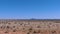 Arizona Grand Canyon A view of a lone mountain in the distance seen from the window of the train