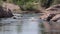 Arizona, Salt River, a view of rapids on the salt river seen through big rocks