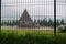 Arjuna and Semar temples behind a black metal gate