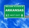 ARKANSAS road sign against clear blue sky