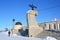 Arkhangelsk, Russia, February, 20, 2018. People walking on cape Pur-Navolok near stele on the embankment of the Northern Dvina