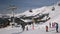 ARKHYZ, RUSSIA - FEBRUARY 2, 2021: Cable car at the ski resort. People on skis.