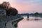 Arles, Provence, France, Promenade at the banks of the River Rhone during a colorful sunset