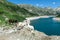 Arlhoehe - A group of goats standing at the shore of an artificial lake in Austria