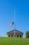 Arlington National Cemetery JFK Memorial American Flag White Cross Green Hill Blue Sky