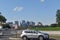 Arlington Skyline as Seen from the Lincoln Memorial with a Silver SUV Parked in the Foreground and an Airplane Flying Overhead