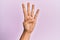 Arm and hand of caucasian young man over pink isolated background counting number 4 showing four fingers