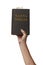 Arm raised into the air with hand reaching up holding the Santa Biblia - Holy Bible in Spanish