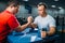 Arm wrestlers prepares for battle at the table