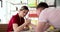 Arm wrestling business woman and businessman during meeting in office