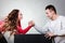 Arm wrestling challenge between young couple