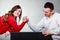 Arm wrestling challenge between young couple