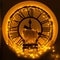 Armchair on the background of a large round clock, decorated with yellow lights